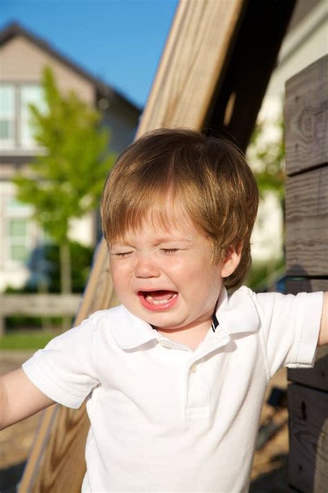 A Young Boy Crying At The Park Stock Photo Image Of Cute Emotion