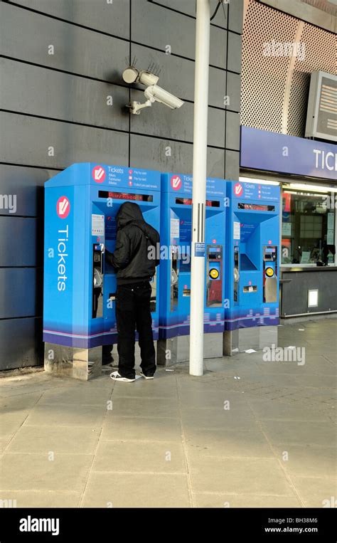 Man At Ticket Machine Finsbury Park Station London England Uk Stock