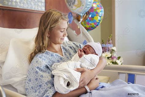 Teenage Girl Holding Newborn Baby Son In Hospital Stock Photo 429015