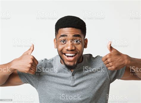 Happy Black Man Showing Thumbs Up At Studio Stock Photo Download