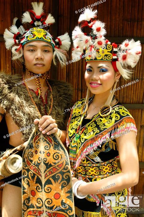 Portrait Of A Traditional Orang Ulu Warrior And Kenyah Woman In Sarawak Borneo Malaysia Stock