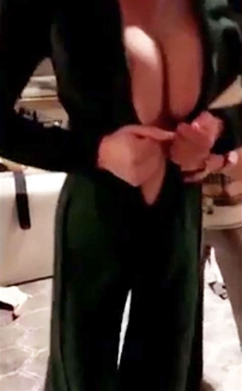 Chrissy Teigen Flaunts MAJOR Cleavage Struggling To Squeeze Into Top