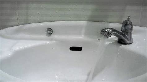 This is a decorative cover that you can easily pry off with a flathead screwdriver in order to reveal a small screw. How to turn off a faucet - YouTube