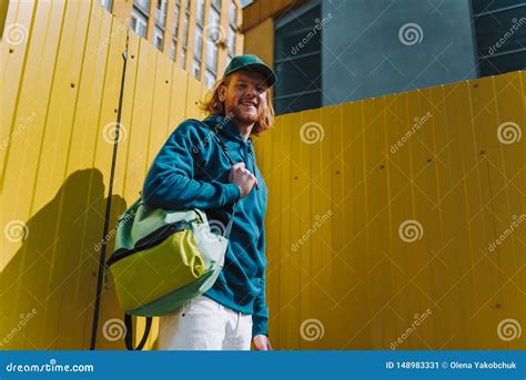 Stylish Young Hipster Man On Yellow Fence View Stock Image Image Of