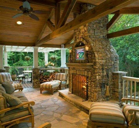 From plain beadboard to beamed and coffered ceilings, your overhead space can be as simple or elaborate as your imagination and budget will allow! Covered patio with rock fireplace | Rock Hard | Pinterest