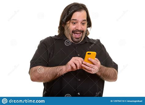 Happy Fat Caucasian Man Laughing While Using Mobile Phone Stock Photo