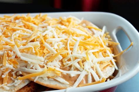 Chicken enchiladas with coriander, avocado and soured cream make for happy faces and full tummies! Easy Chicken Enchilada Casserole - Creole Contessa