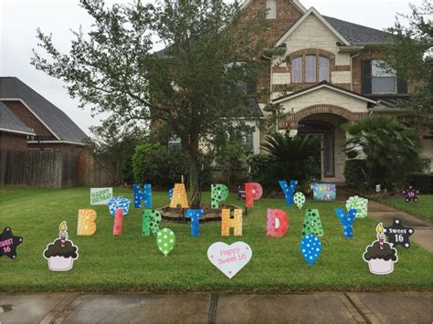 Colorful happy birthday cupcake & balloon yard sign. Lawn Decorations for Birthdays | BirthdayBuzz