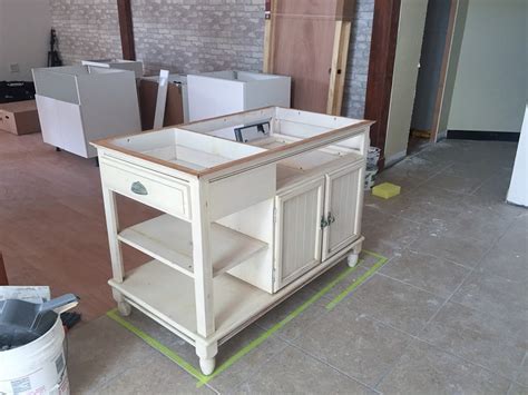 We added a new countertop, legs. A Modern DIY Kitchen Island Makeover on a Budget | Fresh ...