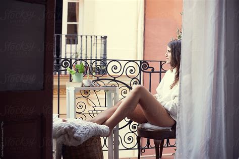 Beautiful Girl Relaxing On Balcony By Guille Faingold