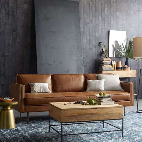 A modern sofa or sectional is a key element in any living room. Modern Living Room with Leather Sofa and Industrial ...
