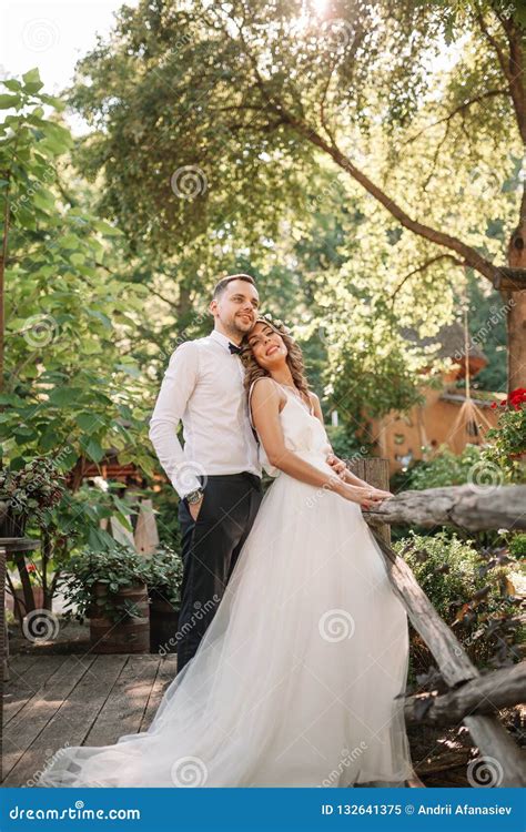 Bride And Groom At Wedding Day Walking Outdoors On Summer Nature Bridal Couple Happy Newlywed