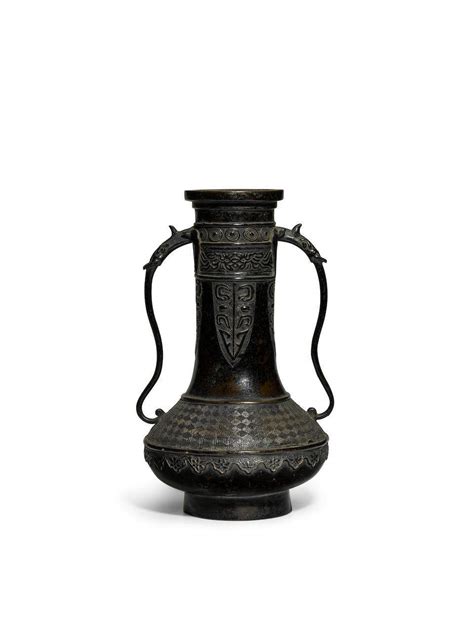 51bidlive An Archaistic Patinated Two Handled Globular Bottle Vase
