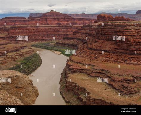 The Colorado River Were It Cut A Canyon Through The Red Colored Cliffs