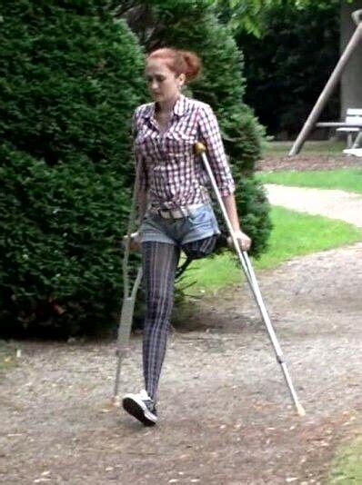 Female Amputees Crutches Empty Pant Leg