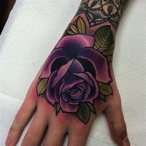 Purple is an especially important color to people who practice eastern religions or any esoteric practices. Purple rose tattoo | Tattoos, Hand tattoos, Purple rose ...