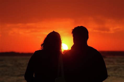 couple in love watching sunset photograph by ioan panaite fine art america