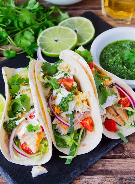 Melt in your mouth fish taco recipe flounder including healthy meal ideas to help you get better. Fish Tacos with a mountain of toppings and TWO sauces - A ...