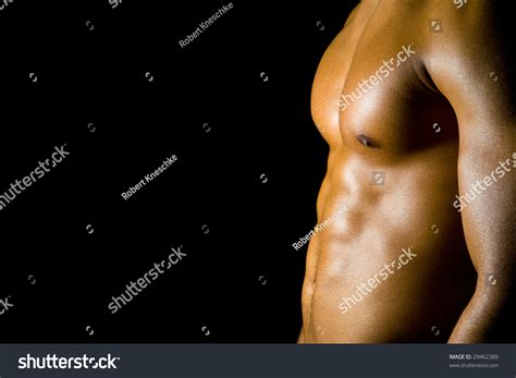 Young Man Flexing His Abdominal Muscles Stock Photo