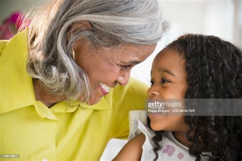 Smiling African American Grandmother And Granddaughter Photo Getty Images