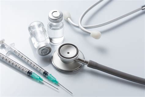 Medical Equipment Stethoscope Ampoules And Syringe On White Ba