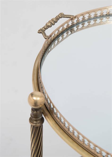 It's incredibly easy to maneuver, rolling effortlessly around your home on its smooth casters. French Vintage Brass and Glass Oval Bar Cart at 1stdibs