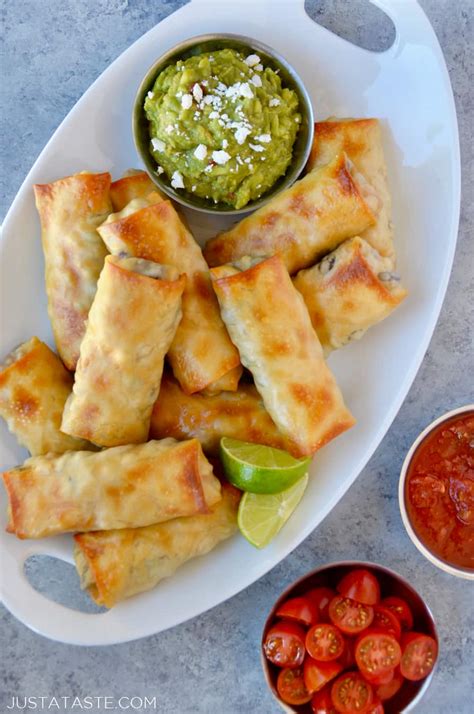 First, preheat your oven to 400˚ and lightly spray a baking sheet with cooking spray and set aside. Baked Southwestern Egg Rolls | Just a Taste
