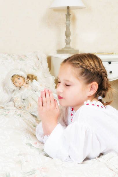 Cute Little Pretty Girl Kneeling And Praying Stock Photos Pictures