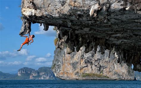 A Human Fly Climbing An Overhanging Cliff Image Abyss
