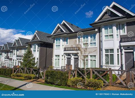 Suburban Residential Street Townhomes. on Bright Sunny Spring Day
