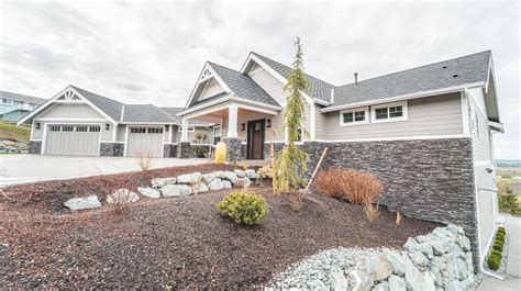 This kitchen/ living area features shrock cabintry from masterbrand cabinets. Olson Custom Home - BYK Construction