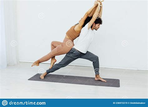 Man And Woman Engaged In Yoga Asana Gymnastics Stock Image Image Of