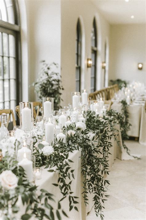 Luxury Wedding Table Styling With White Pillar Candles Glass Cylinders And Foli… Candle Wedding