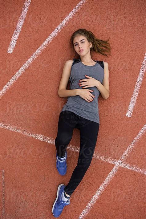 Woman Laying On Track By Stocksy Contributor Milles Studio Female Pose Reference Pose