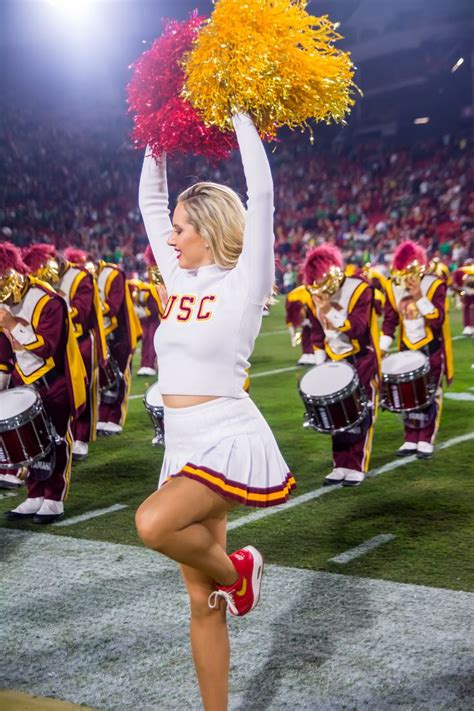 a cheerleader is performing on the field