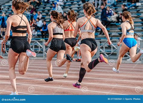 rear view group female athlete runners running sprint race editorial photo image of back