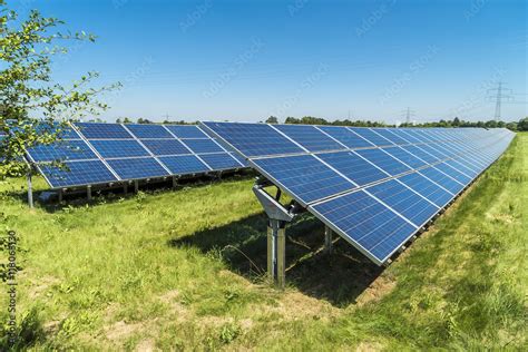 Solaranlage Und Stromtrasse Auf Gr Nem Rasen Stock Photo Adobe Stock