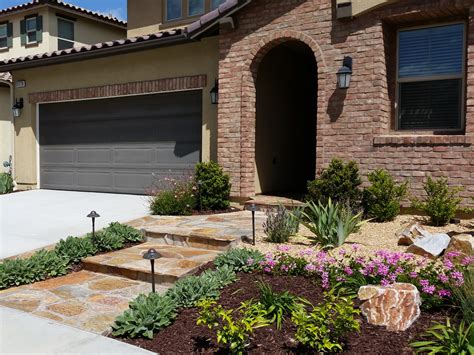 Mediterranean Front Yard With Flagstone Mccabes Landscape Construction