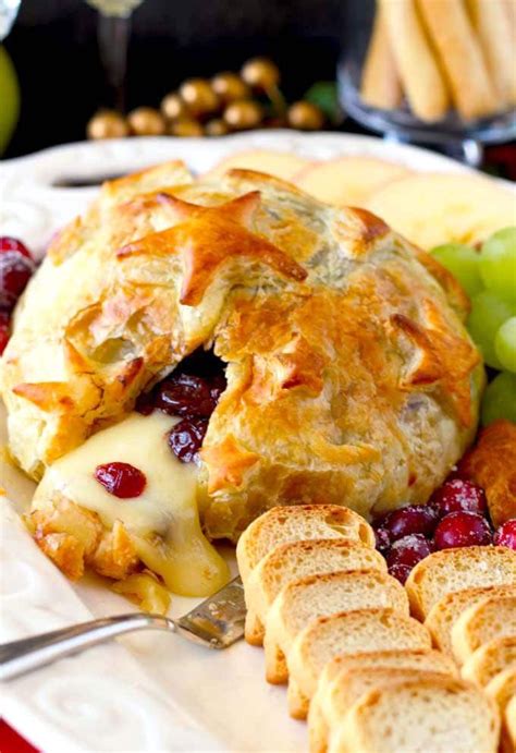 Baked Brie With Cranberries Appetizer Served On A White Platter Brie
