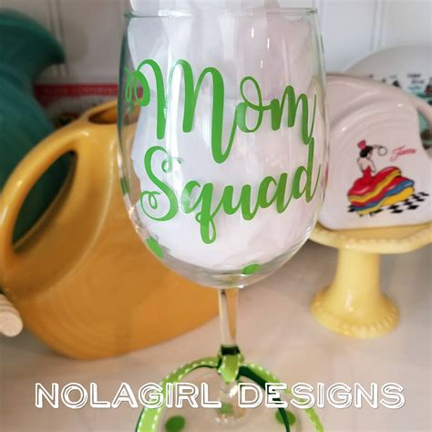 Add all of her kids' (or grandkids') names to a cookie jar or their photos on a personalized blanket or pillow. Mom squad, Wine Glass, Custom colors, Mothers day gify ...
