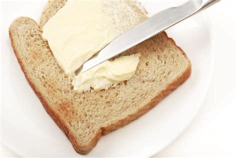 Spreading Butter On Bread Stock Photo Image Of Piece