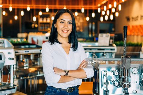 Portrait Of Young Female Small Business Owner In A Her Shop High-Res 