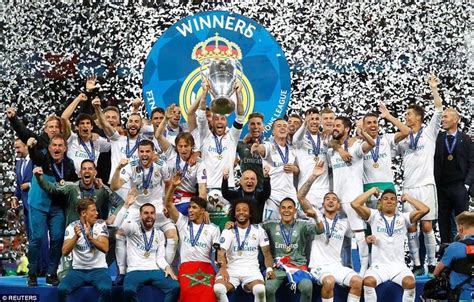 The Real Madrid Team Celebrate With The Trophy After Winning The La