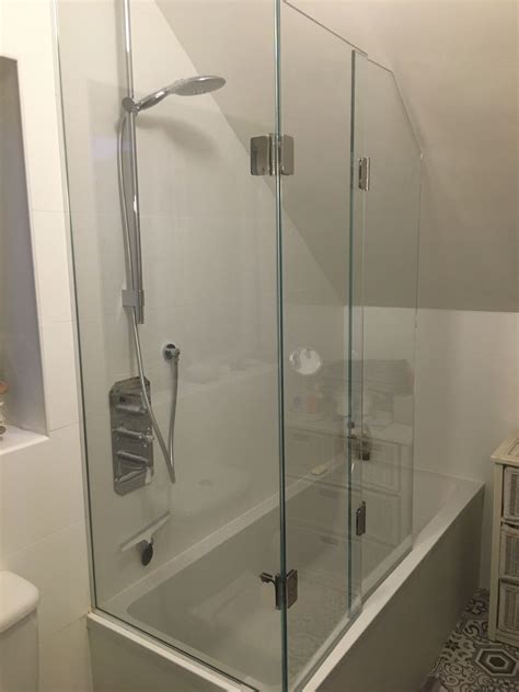 Frameless Bifold Bath Shower Screen To Open Ended Bath With Sloping