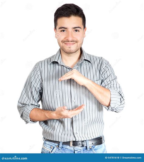 Young Casual Man Holding Something On Hands At White Background Stock