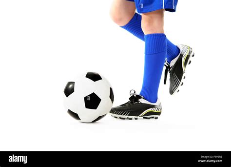 Boy Kicking Soccer Ball Stock Photo Alamy