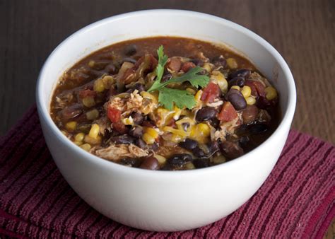 Put your onions, beans, corn, diced tomatoes, tomato sauce and beer (everything is undrained) in your crock pot and mix well. Crock Pot Chicken Taco Soup | Wishes and Dishes