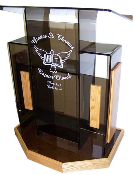 An Award Is Displayed On A Wooden Stand With Black Glass And Wood Trimmings