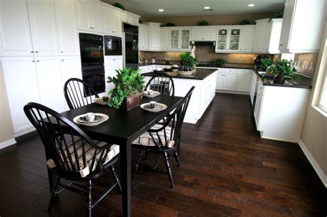 Dark wooden floor in a large kitchen. 35 Striking White Kitchens with Dark Wood Floors (PICTURES)