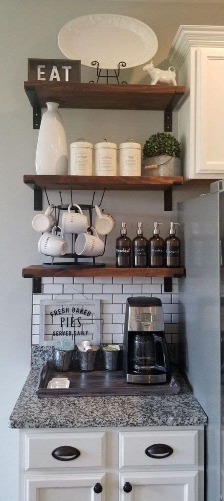 Bar countertops are not just perfect for meals, they also function as space in the kitchen. This coffee corner idea for a small space features a ...